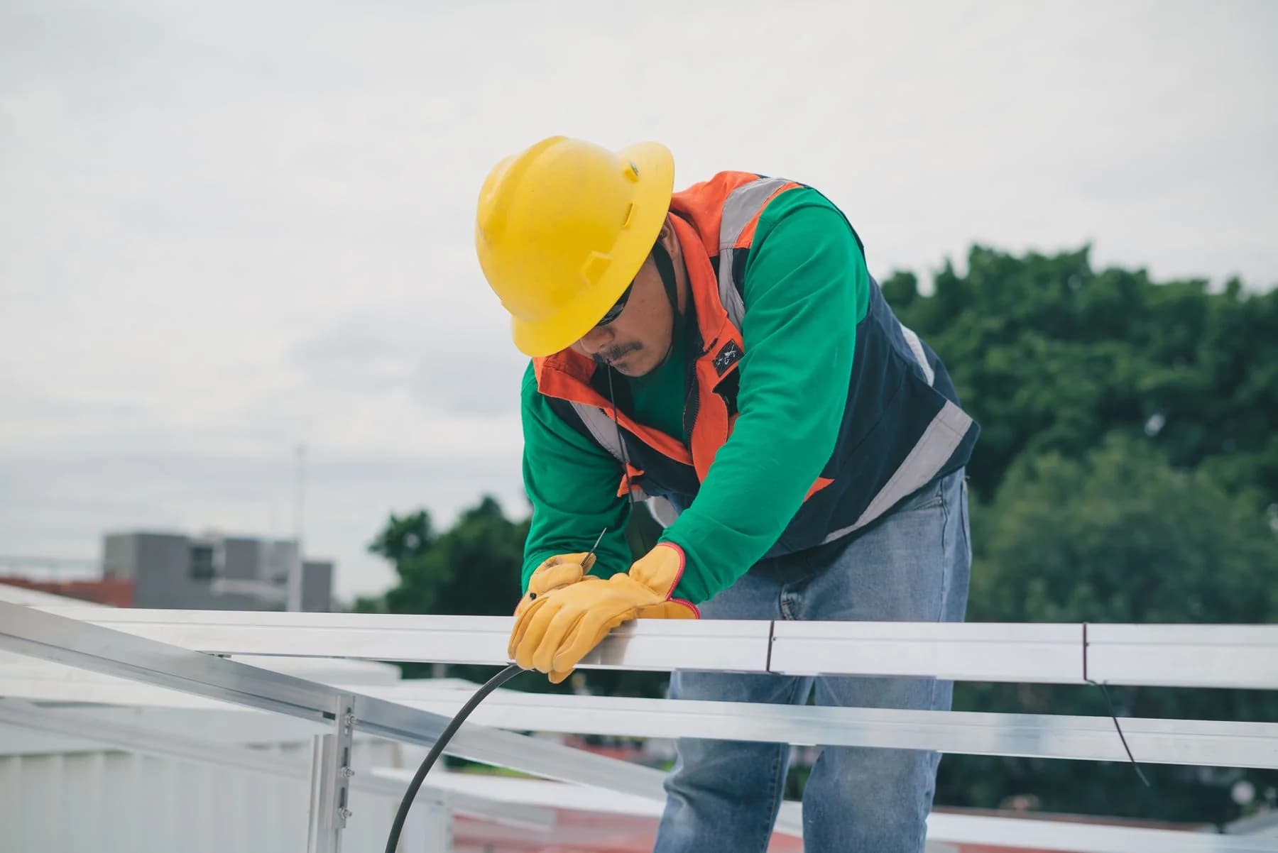 Construction professional assembling an aluminium frame for a renewable energy installation