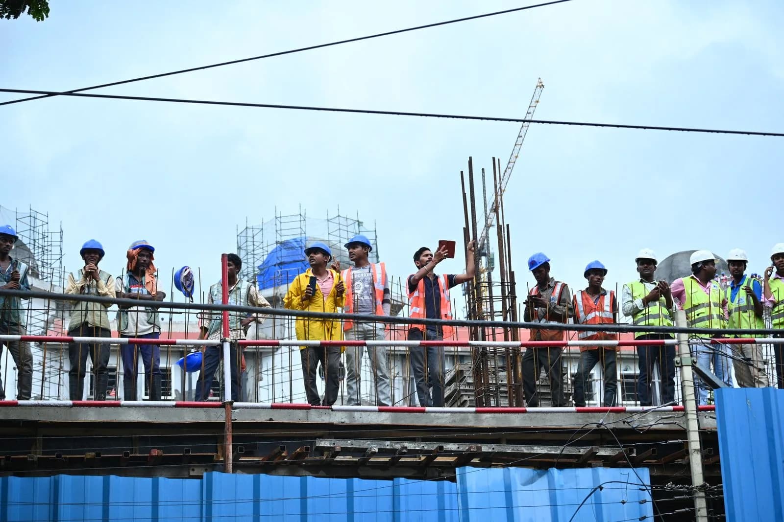 Professional construction crew working safely on scaffolding