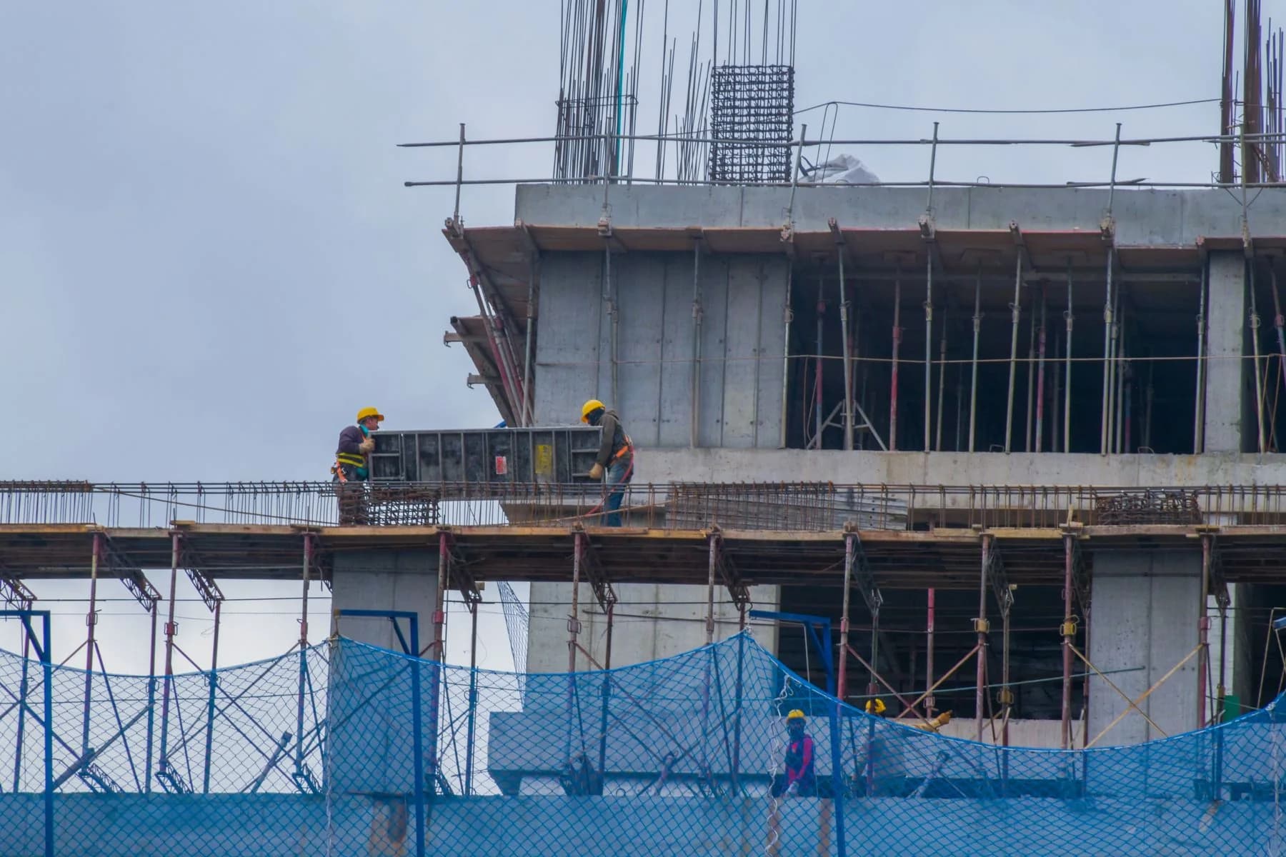 Construction professionals working safely on an active building site
